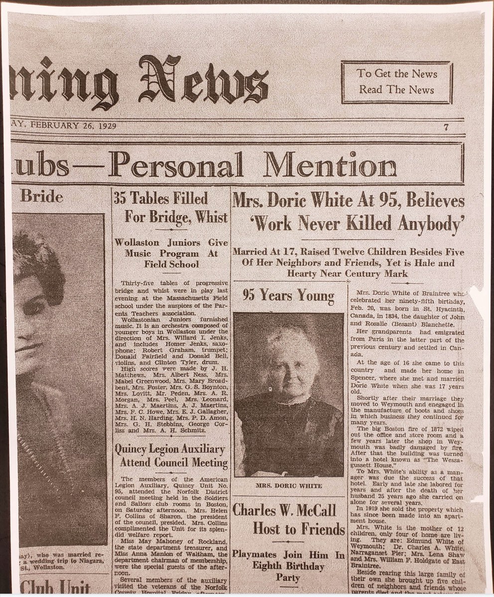 A page of the Quincy Evening News from February 26, 1929, with the headline “Mrs. Doric White At 95, Believes ‘Work Never Killed Anybody,’” a portrait captioned Mrs. Doric White, and an article saying she was born in St. Hyacinth, Canada, in 1834, the daughter of John and Rosalie (Besant) Blanchette, and that her grandparents had emigrated from Paris.